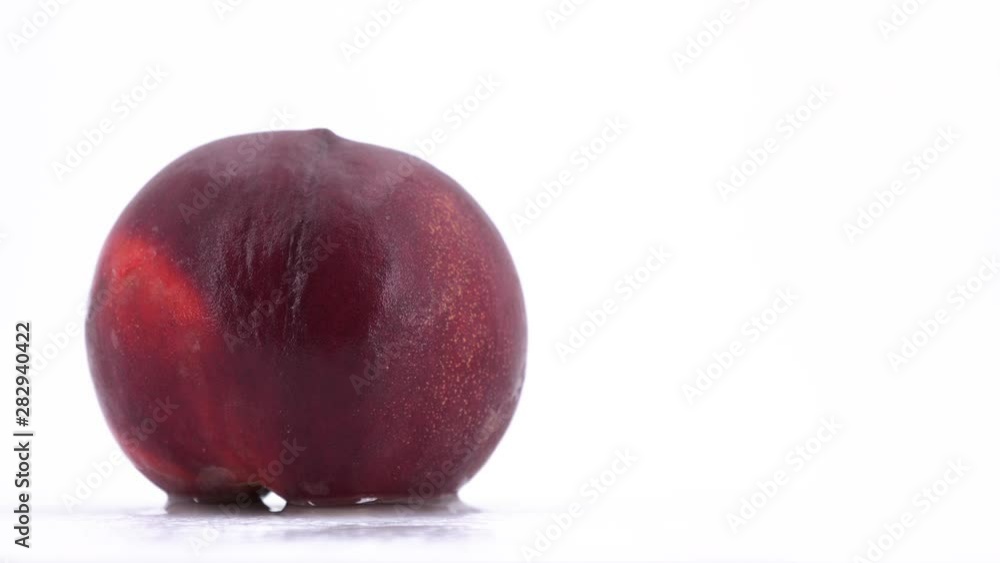 Single ripe peach rotating, (loopable) on white background, copy space. Shot in 4K Single ripe peach rotating, (loopable) on white background, copy space. Shot in 4K