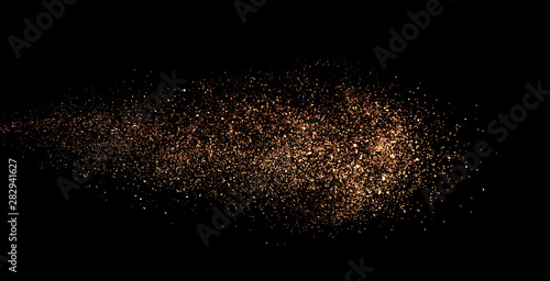 a shot from a firearm, an explosion of gunpowder on a black background, a bright flash with flying particles, abstract shape photo