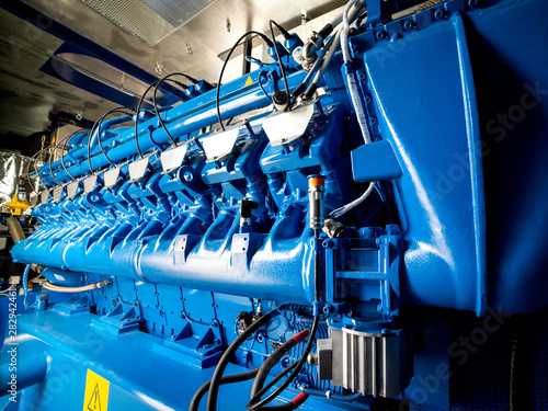 Engine of CHP unit. Diesel and gas industrial electric generator. photo