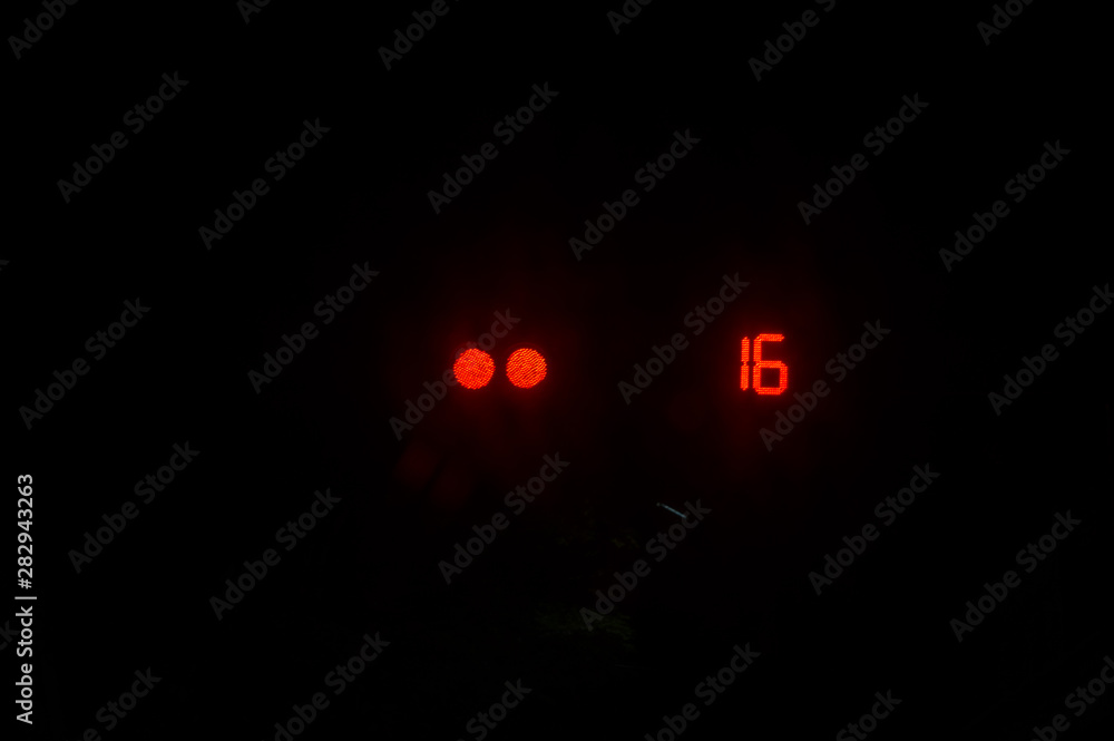 traffic light in red with countdown time - number 16