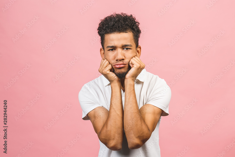 Serious afro american man thinking isolated over pink background. Serious afro american man thinking isolated over pink background.