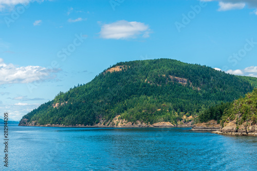 Fototapeta Naklejka Na Ścianę i Meble -  View over Inlet, ocean and island with mountains in beautiful British Columbia. Canada.