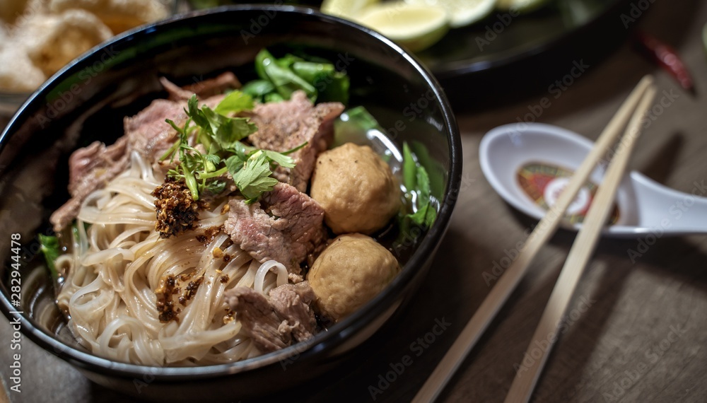 Thai style noodle blood soup,boat noodle,delicious dish,famous Thai noodle soup. Thai peoples call Boat Noodles. Close up or selective focus Thai style noodle blood soup,boat noodle,delicious dish,famous Thai noodle soup. Thai peoples call Boat Noodles. Close up or selective focus