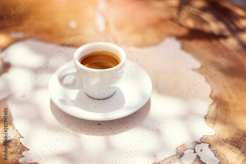 top view a cup of espresso coffee on wooden table background