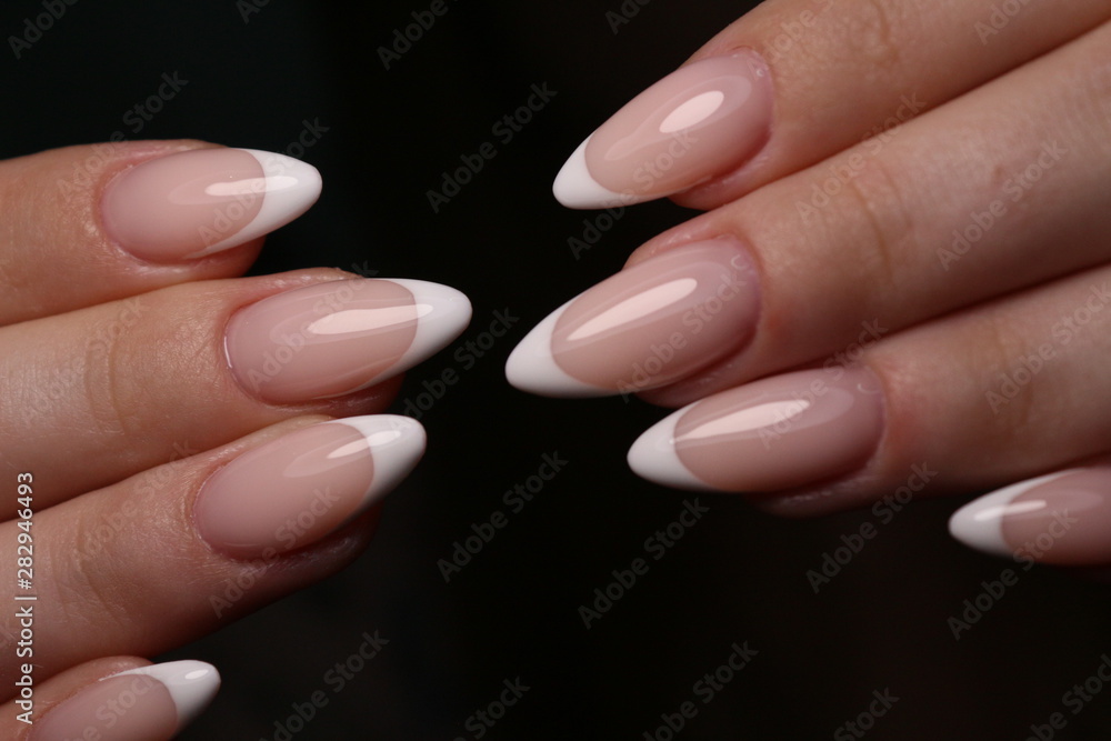 Closeup photo of a beautiful female hands with elegant manicure Closeup photo of a beautiful female hands with elegant manicure