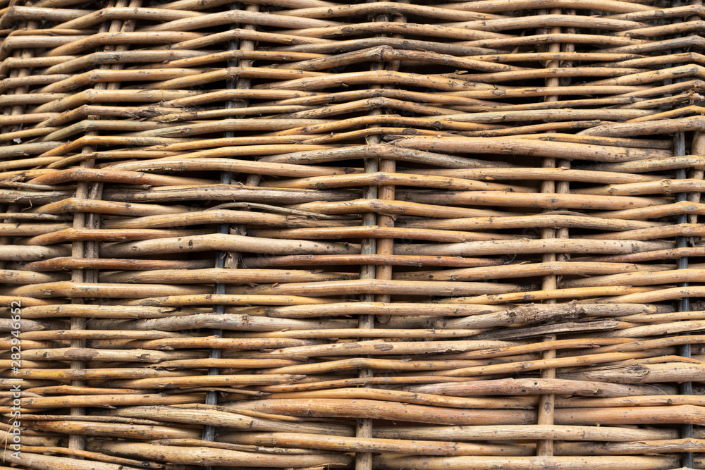 Horizontally interwoven brown willow twigs, top view Horizontally interwoven brown willow twigs, top view