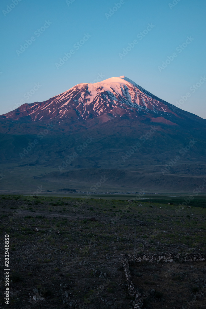 Breathtaking sunset on Mount Ararat, Agri Dagi, the highest mountain in the extreme east of Turkey accepted in Christianity as the resting place of Noah's Ark, snow-capped and dormant compound volcano Breathtaking sunset on Mount Ararat, Agri Dagi, the highest mountain in the extreme east of Turkey accepted in Christianity as the resting place of Noah's Ark, snow-capped and dormant compound volcano