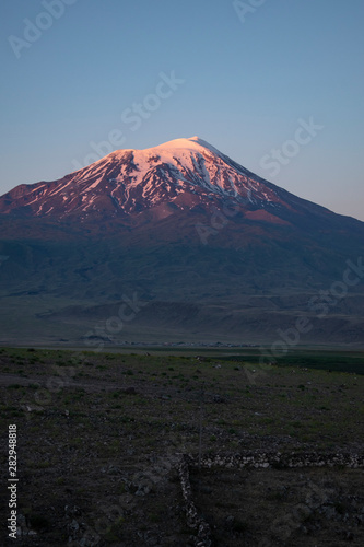 Breathtaking sunset on Mount Ararat, Agri Dagi, the highest mountain in the extreme east of Turkey accepted in Christianity as the resting place of Noah's Ark, snow-capped and dormant compound volcano