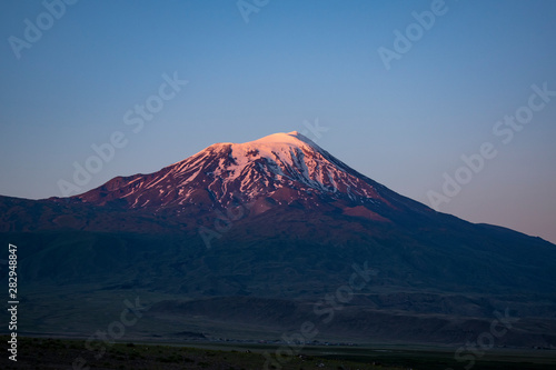 Breathtaking sunset on Mount Ararat, Agri Dagi, the highest mountain in the extreme east of Turkey accepted in Christianity as the resting place of Noah's Ark, snow-capped and dormant compound volcano