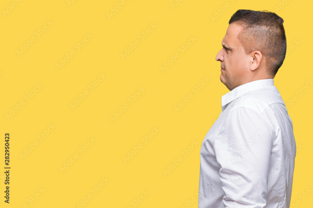 Middle age arab elegant man over isolated background looking to side, relax profile pose with natural face with confident smile. Middle age arab elegant man over isolated background looking to side, relax profile pose with natural face with confident smile.