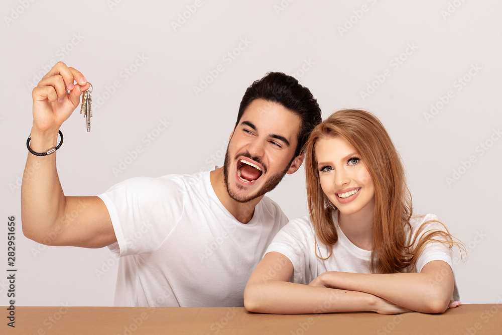 Fototapeta premium Happy couple with keys to new home.