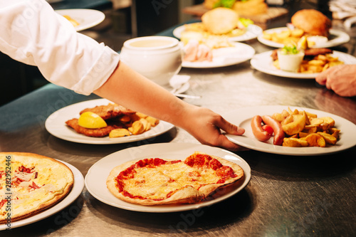 Food orders on the kitchen table in the restaurant