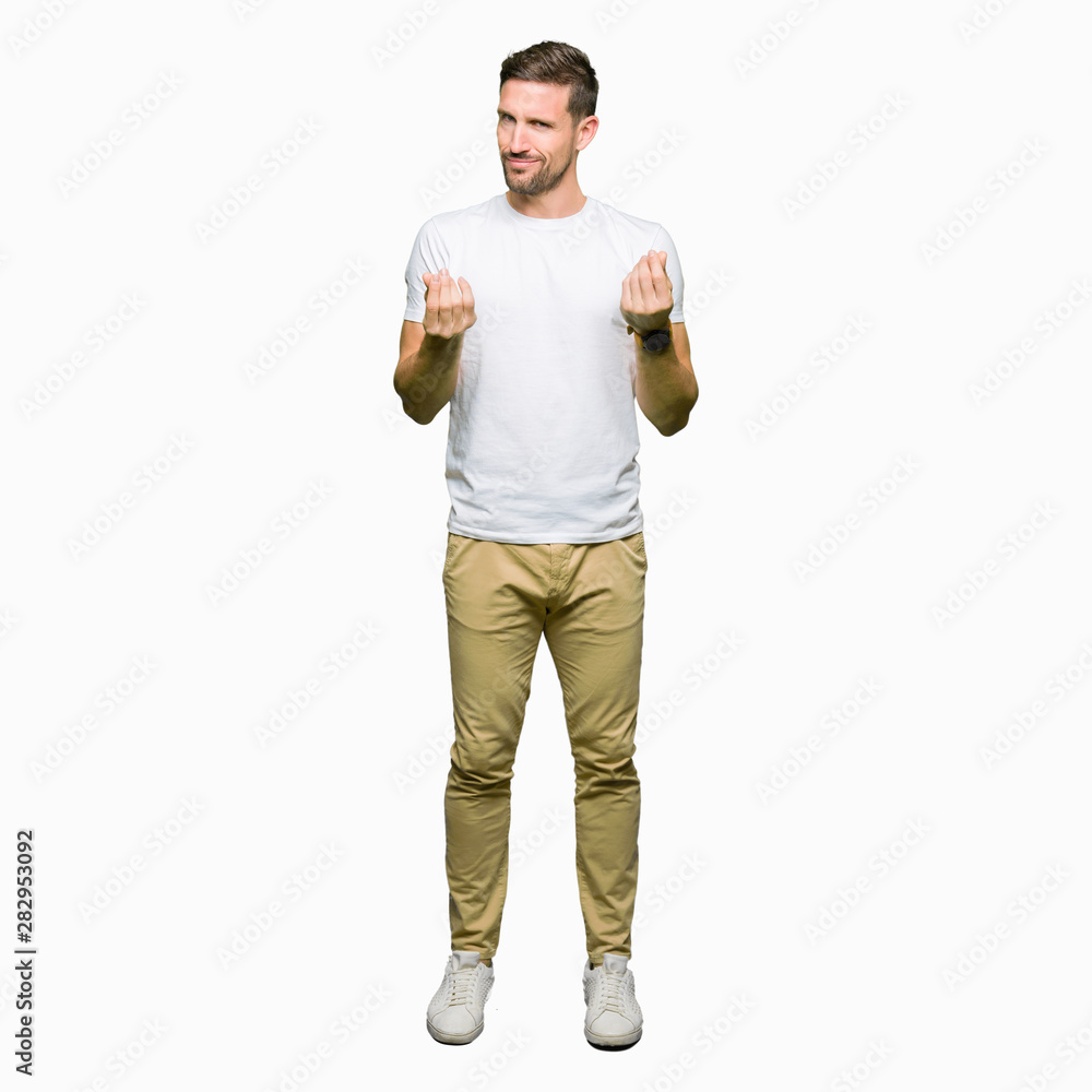 Handsome man wearing casual white t-shirt Doing money gesture with hand, asking for salary payment, millionaire business Handsome man wearing casual white t-shirt Doing money gesture with hand, asking for salary payment, millionaire business