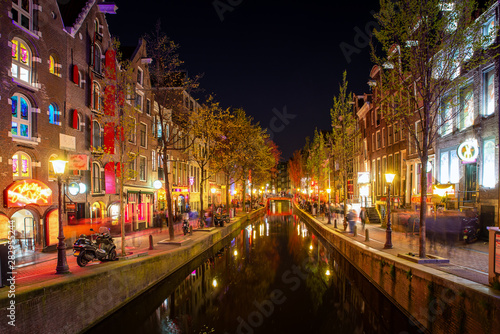Red light district in Amsterdam, Netherlands at night. Nightlife in in Amsterdam, Netherlands © ake1150