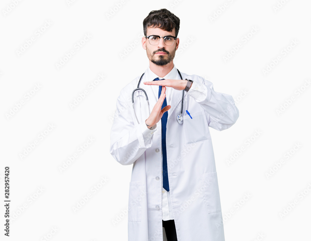 Young doctor man wearing hospital coat over isolated background Doing time out gesture with hands, frustrated and serious face Young doctor man wearing hospital coat over isolated background Doing time out gesture with hands, frustrated and serious face