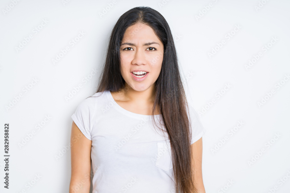 Beautiful brunette woman over isolated background afraid and shocked with surprise expression, fear and excited face. Beautiful brunette woman over isolated background afraid and shocked with surprise expression, fear and excited face.