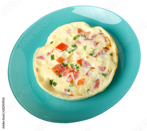 omelet with tomatoes and green onions on a plate isolated on white background.omelet top view. healthy breakfast