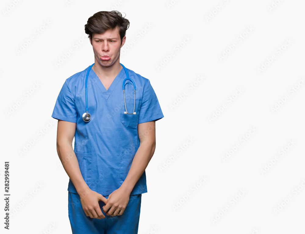 Young doctor wearing medical uniform over isolated background depressed and worry for distress, crying angry and afraid. Sad expression. Young doctor wearing medical uniform over isolated background depressed and worry for distress, crying angry and afraid. Sad expression.