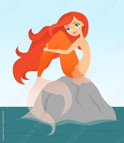 Red haired mermaid sitting on a rock