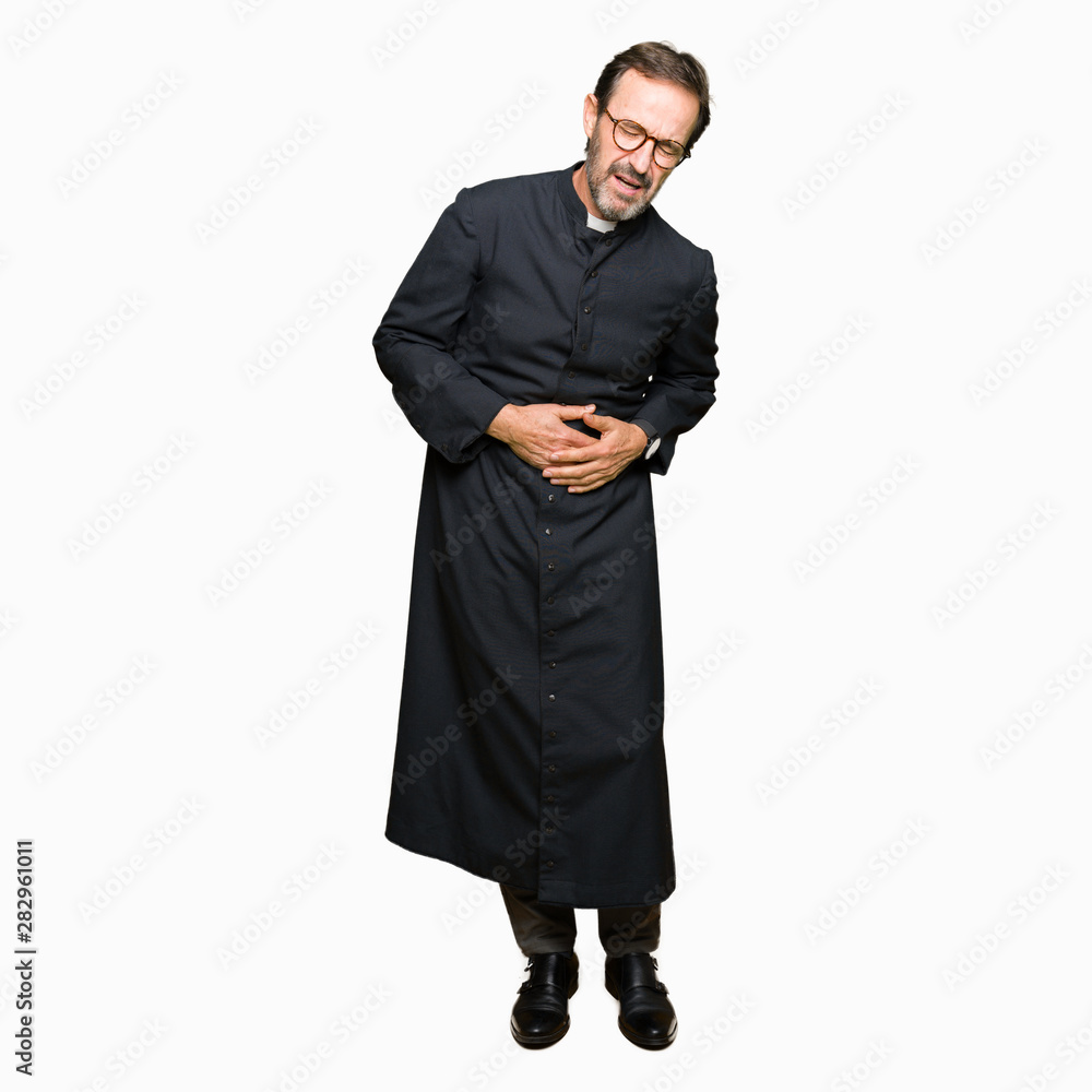 Middle age priest man wearing catholic robe with hand on stomach because nausea, painful disease feeling unwell. Ache concept. Middle age priest man wearing catholic robe with hand on stomach because nausea, painful disease feeling unwell. Ache concept.