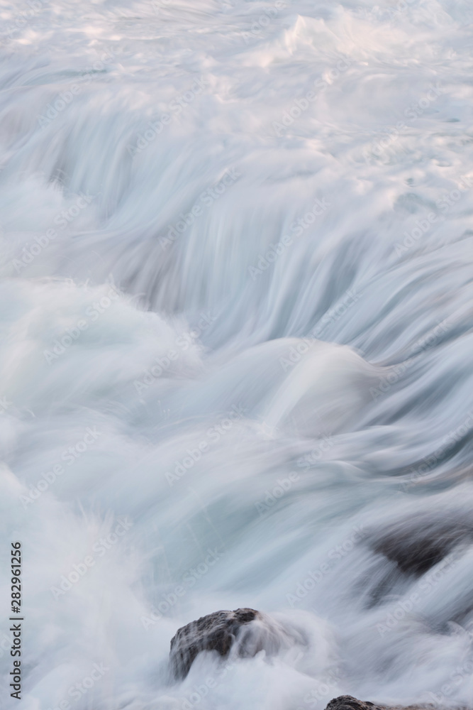 Water flow motion over rocks during big swell in Australia Water flow motion over rocks during big swell in Australia