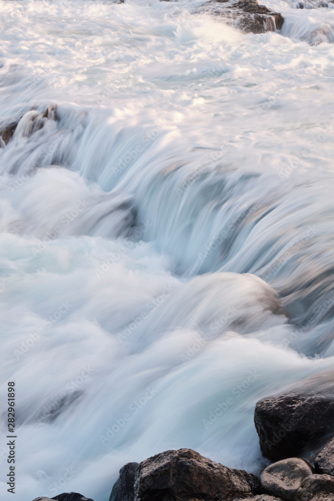 Water flow motion over rocks during big swell in Australia Water flow motion over rocks during big swell in Australia