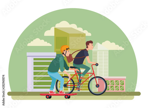Young male friends with bike and skateboard