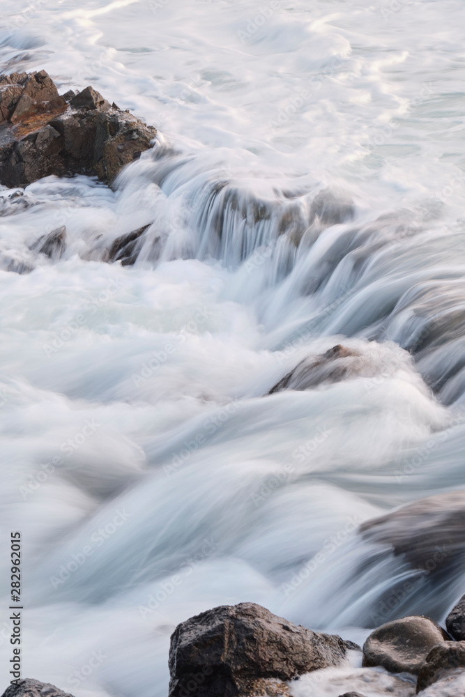 Water flow motion over rocks during big swell in Australia Water flow motion over rocks during big swell in Australia