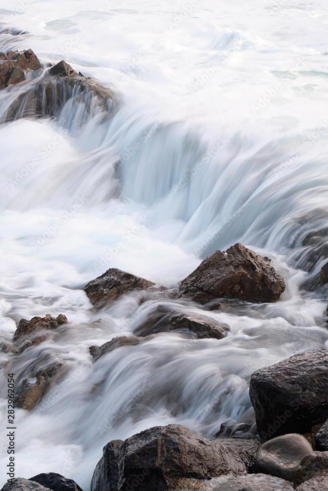 Water flow motion over rocks during big swell in Australia Water flow motion over rocks during big swell in Australia