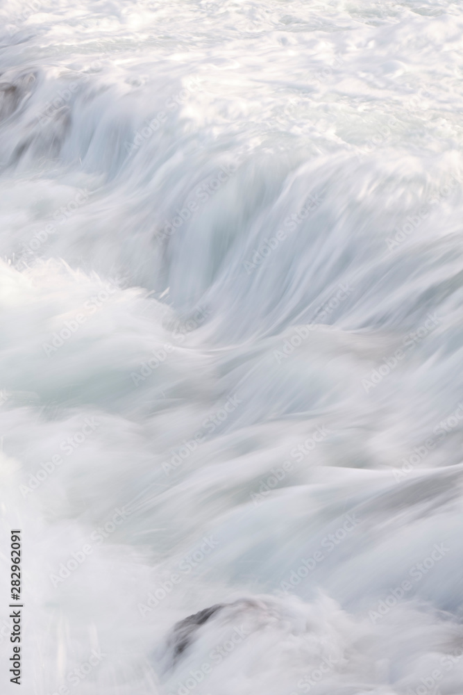 Water flow motion over rocks during big swell in Australia Water flow motion over rocks during big swell in Australia