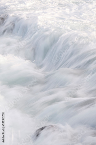 Water flow motion over rocks during big swell in Australia