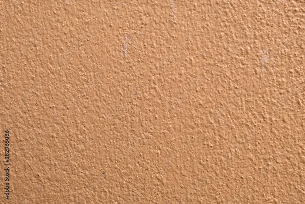 Brown cement wall background close up Brown cement wall background close up