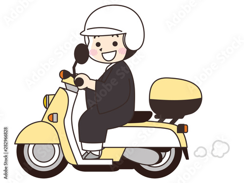 原付に乗る住職