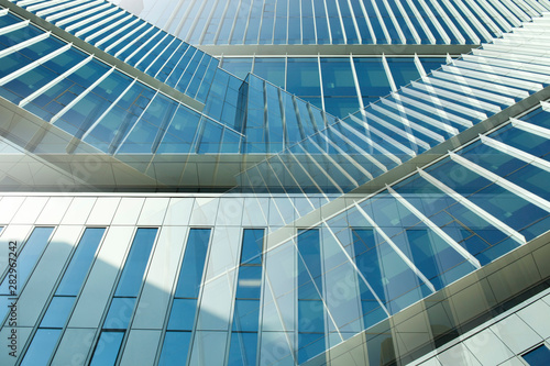 Abstract shiny metal and glass background using office building facade pattern
