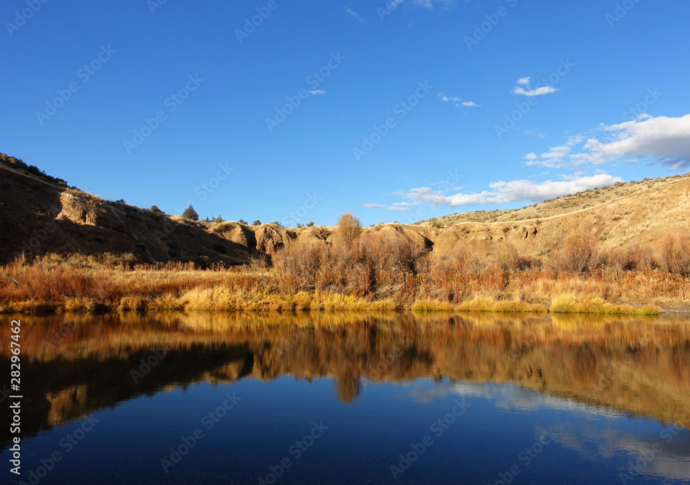 Beautiful fall colors reflecting on the John Day River of Eastern Oregon Beautiful fall colors reflecting on the John Day River of Eastern Oregon