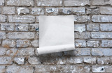 paper on brick wall