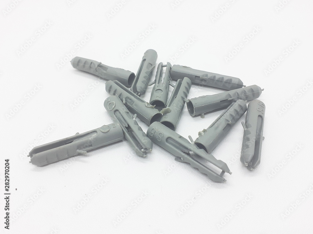 Bolt ans Fischer for Mechanical and Industrial Purpose in White Isolated Background Bolt ans Fischer for Mechanical and Industrial Purpose in White Isolated Background
