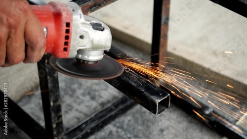 Wallpaper Mural Deformed bars steel cutting saw for metal with bright sparks - 4K Torontodigital.ca