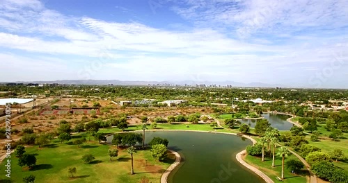 Aerial push in from the edge of the urban desert to the skyline of Phoenix, Arizona Concept: desert living, urban heat island, ​Arizona photo