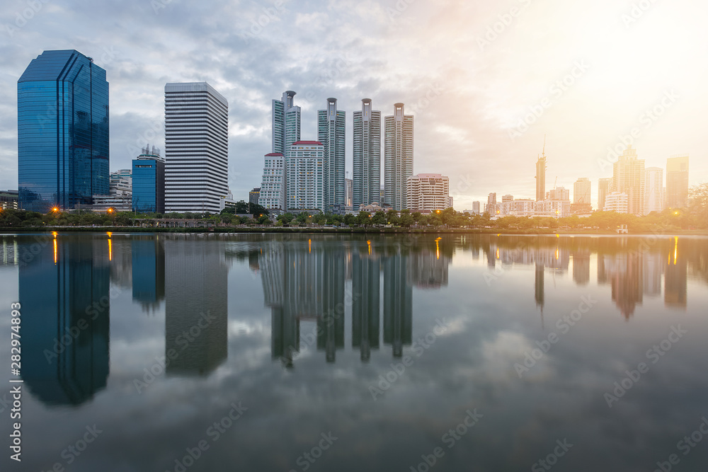 City building with water reflection before sunset