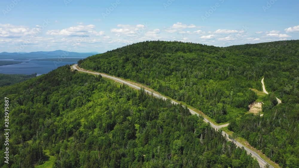 Aerial flight following road scenic destination Rangeley Lake Aerial flight following road scenic destination Rangeley Lake