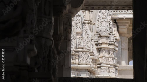 Ranakpur Jain temple in India - ornate detail of white marble carvings photo