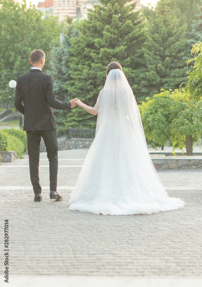 bridesmaid encouragingly holds the bride's hand bridesmaid encouragingly holds the bride's hand