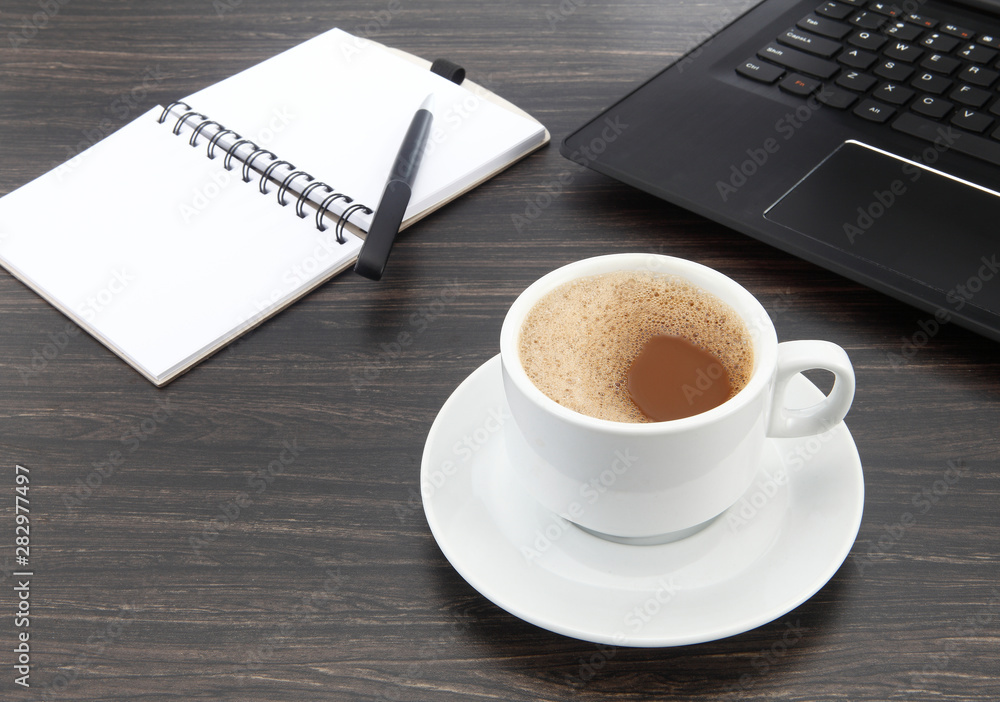 cup of coffee and pen on laptop cup of coffee and pen on laptop
