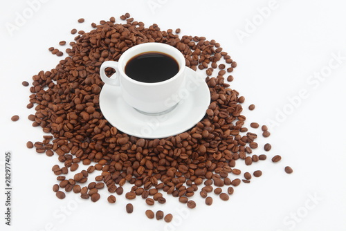 cup of coffee with beans on white background