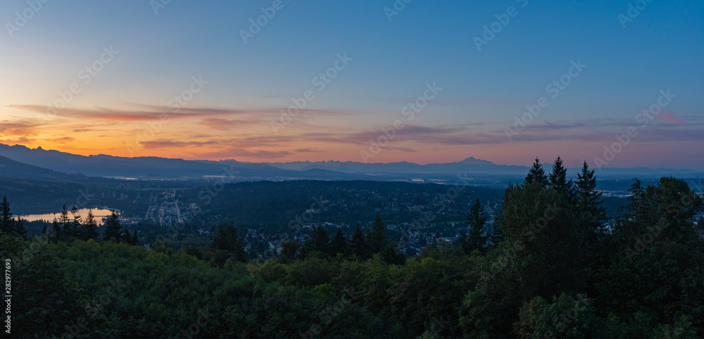 Fototapeta premium New Day Dawning In Fraser Valley Against Silhouetted Mountains