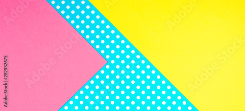 Texture background of fashion papers in memphis geometry style. Yellow, blue, pink colors