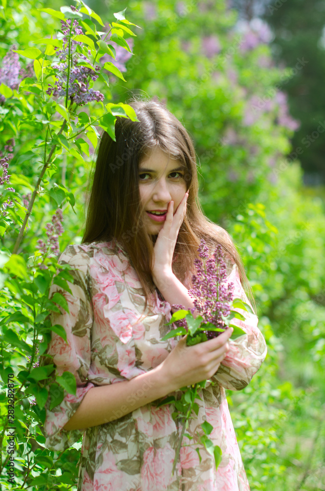 beautiful girl in a blooming Park beautiful girl in a blooming Park