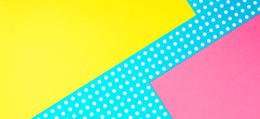Texture background of fashion papers in memphis geometry style. Yellow, blue, pink colors