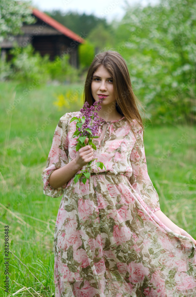 beautiful girl in a blooming Park beautiful girl in a blooming Park